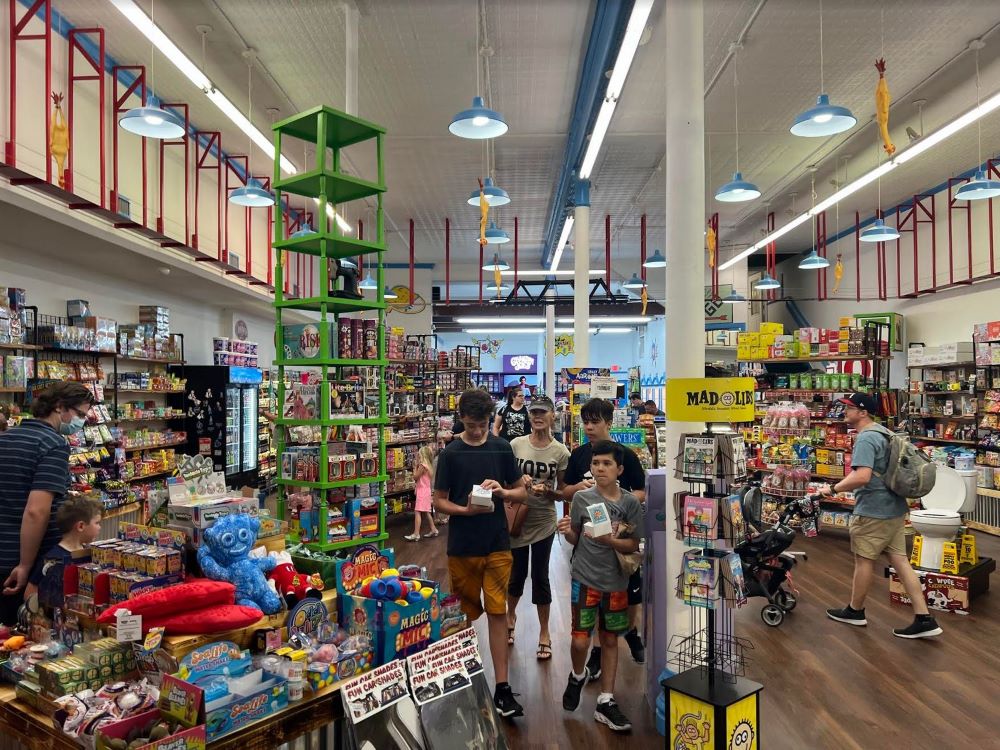 https://www.ocala-news.com/wp-content/uploads/2022/07/Grandpa-Joes-Candy-Shop-inside-store-with-customers-resized.jpg