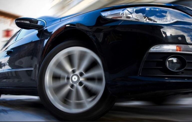 fast moving car with blurred background (cropped) stock image