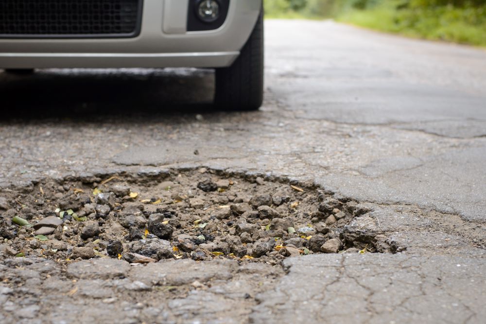 pothole in road (stock image)