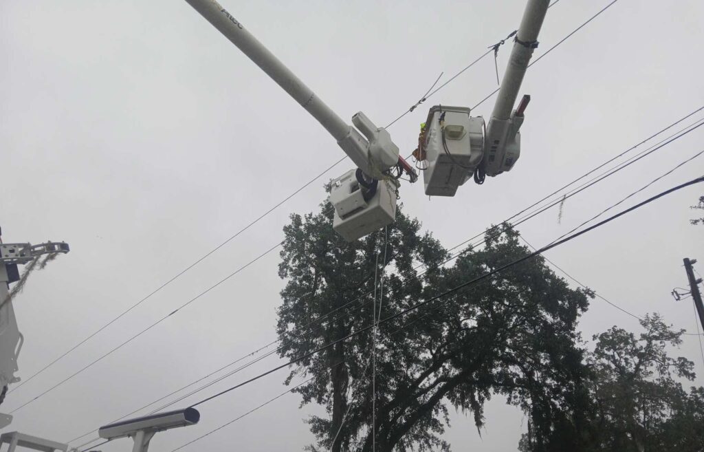 Ocala Electric Utility crews work to fix power lines damaged by downed trees in the wake of Hurricane Debby. (Photo: Ocala Electric Utility)