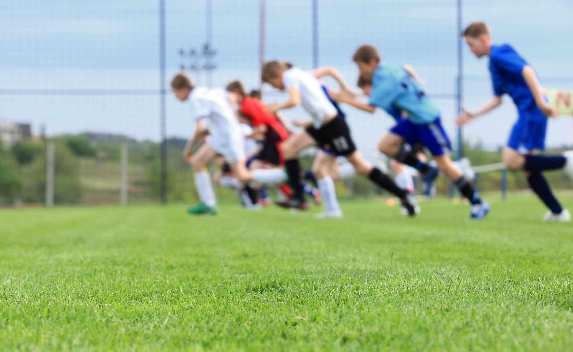 Sports athletes training and running on turf