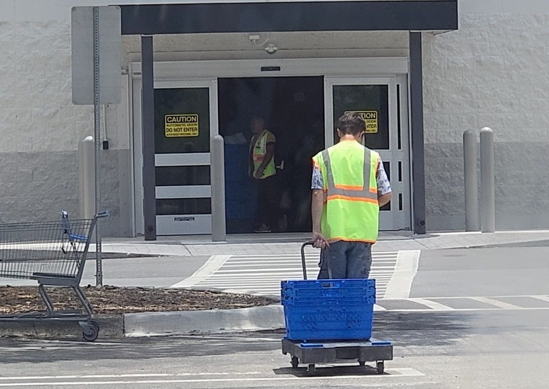 Walmart employee Joshua walking away after chivalrous act