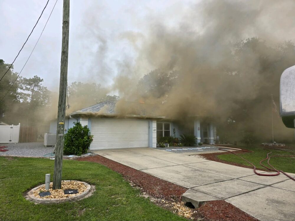 Silver Springs house fire on September 8, 2024 smoke and flames rising from roof photo by MCFR 2