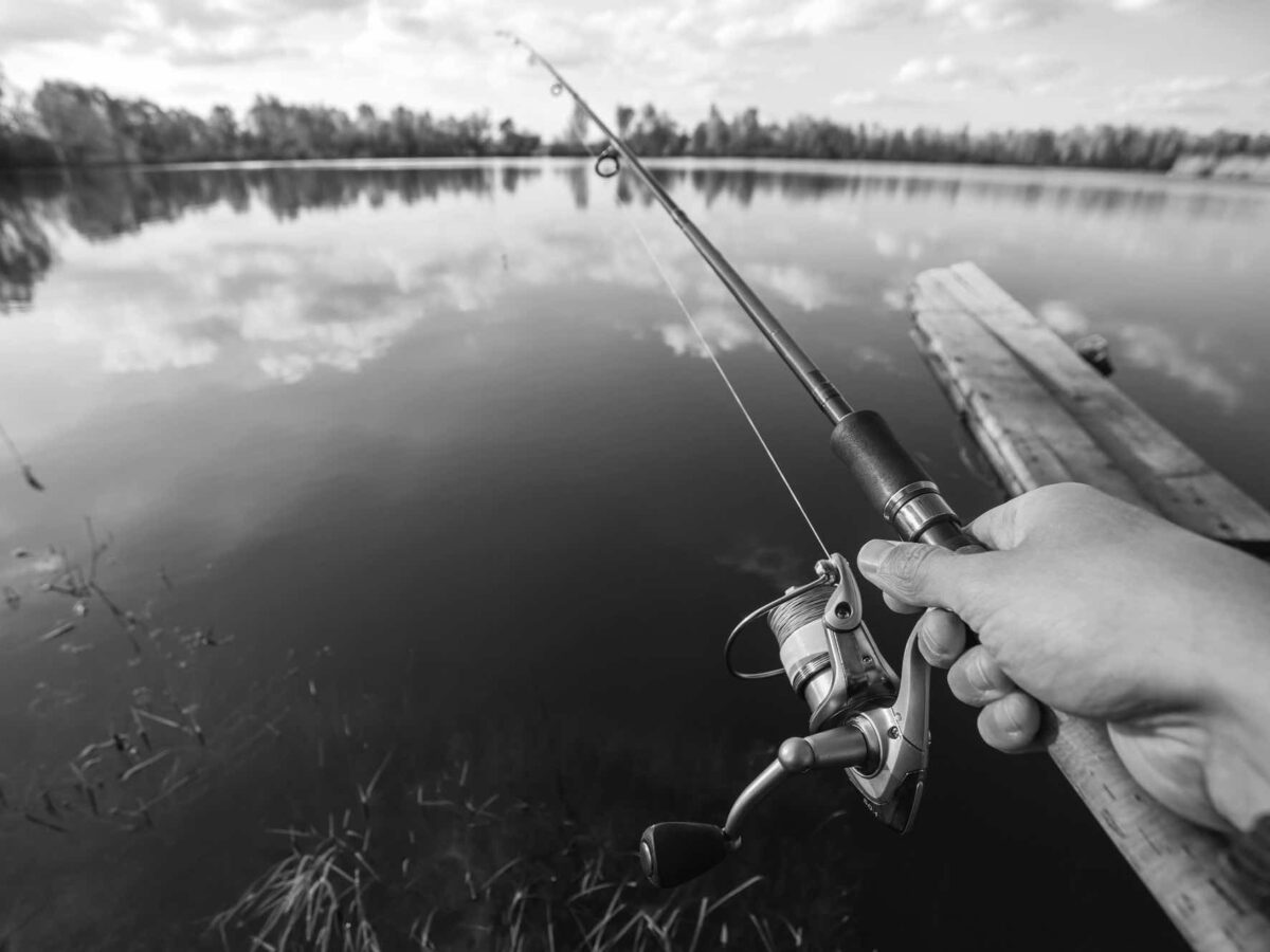 Fishing with rod on lake