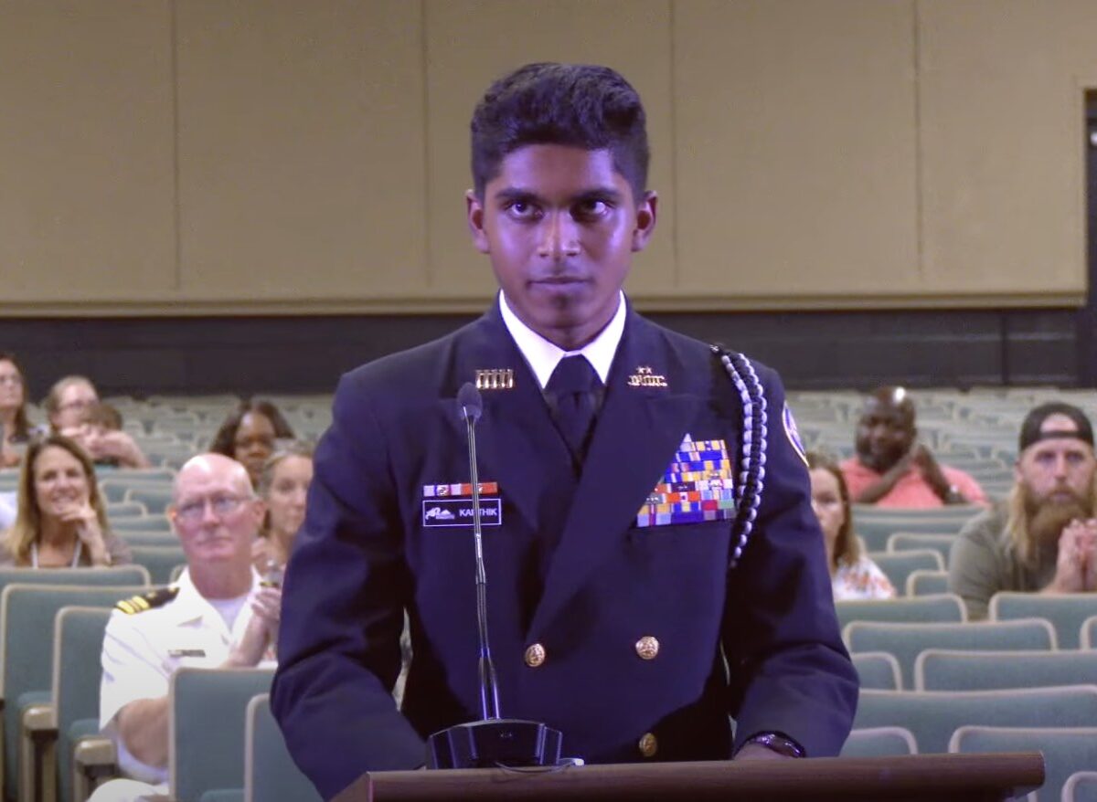 Sanjay Karthik leads the Marion County School Board in the Pledge of Allegiance on Tuesday, November 12.