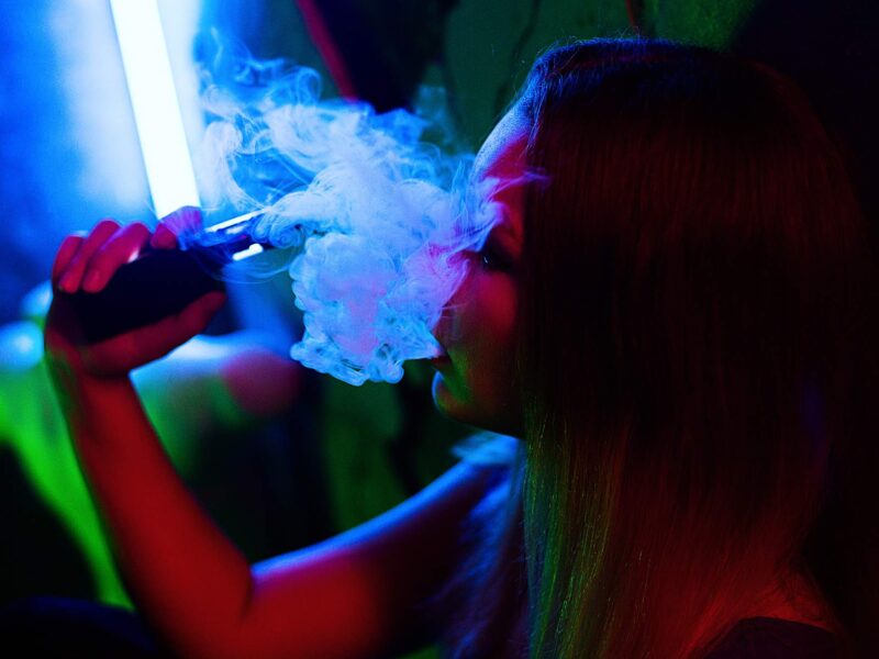 Girl vaping using vape pen